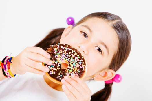 Portrait of a girl holding a donut