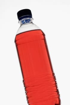 Close-up of a bottle of red liquid