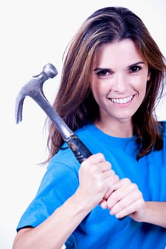 Portrait of a young woman holding a hammer