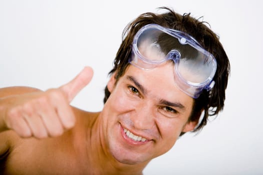 Portrait of a mid adult man showing Thumbs Up sign