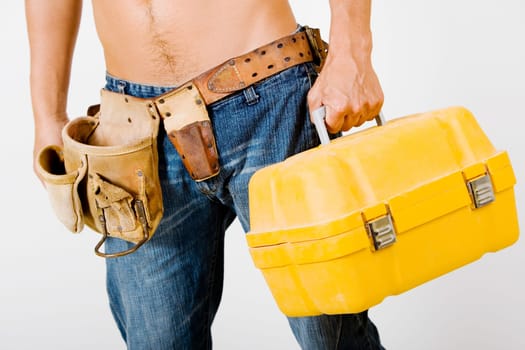 Mid section view of a man holding a toolbox