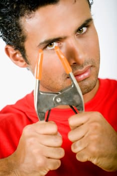 Portrait of a young man holding a clamp