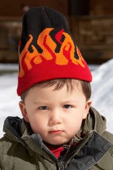 Portrait of a boy wearing a knit hat