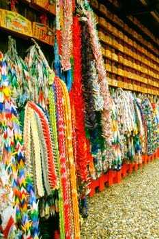 Large group of origami products hanging on the wall