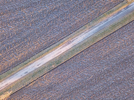 winter road, landscape covered by morning frost, top down aerial view, landscape. Simplicity concept landscape composition.