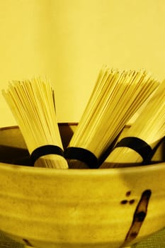 Close-up of raw spaghetti in a bowl