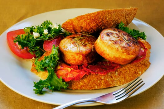 Close-up of roast meat and bread on a plate