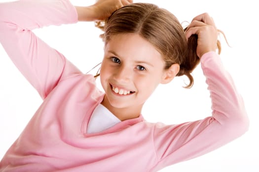 Portrait of a girl holding her pigtails