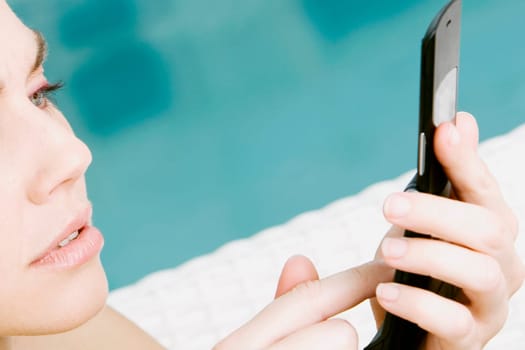 Close-up of a young woman using a mobile phone