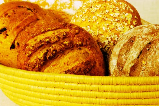 Close-up of brown bread and buns in a basket