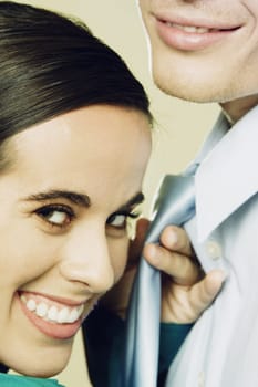 Close-up of a businesswoman holding a businessmanŽs tie