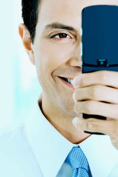 Close-up of a businessman looking at a mobile phone