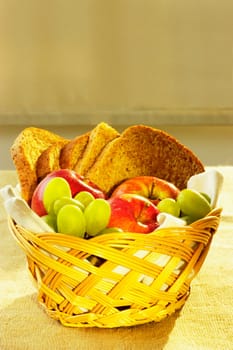 Close-up of fruit and brown bread in a basket