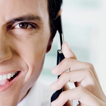 Portrait of a young man talking on a mobile phone
