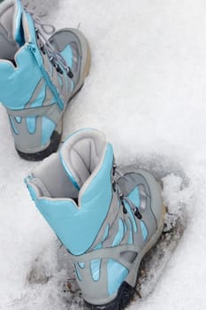 Close-up of ski boots in snow