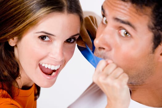 Portrait of a mid adult woman sticking an adhesive tape on a young manŽs mouth