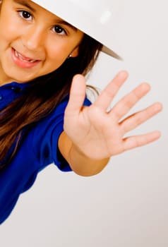 Portrait of a girl making a stop hand gesture
