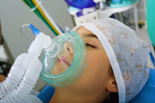 Close-up of a female patient wearing an oxygen mask