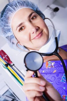 Portrait of a female doctor holding a stethoscope