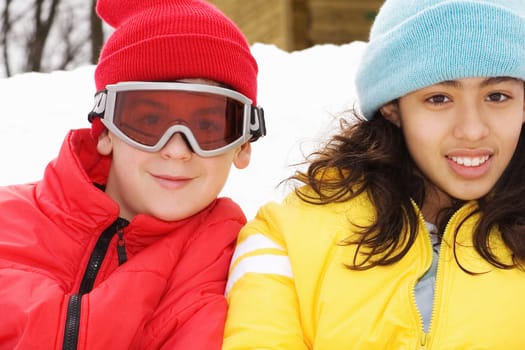 Portrait of a boy and a teenage girl smiling