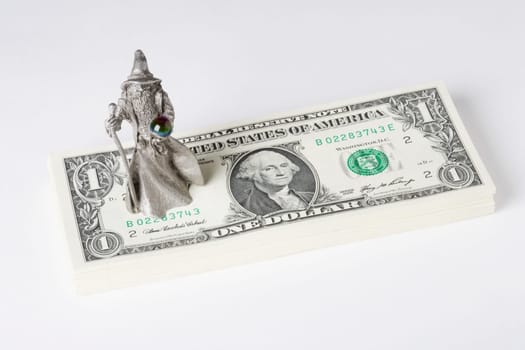 Figurine of a fortune teller on US paper currency