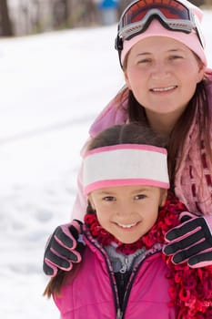 Mid adult woman standing with her daughter