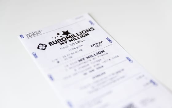 BAYONNE, FRANCE - CIRCA JANUARY 2021: Francaise des Jeux Euromillions receipt on white background. EuroMillions is a European transnational lottery, it was launched in 2004.