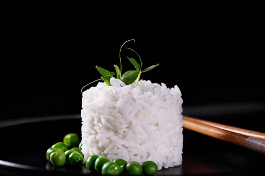 An overhead photo of a bowl of cooked white long grain rice, shot from above on a teal blue background with a place for text