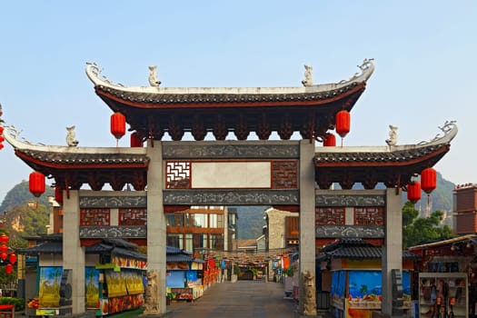 Chinese pagoda in a tourist town in Guilin, as a gateway to the local bazaar in the morning 24.08.2019