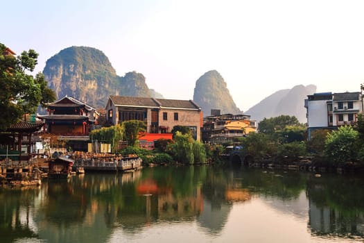 View of the cityscape by the lake among the mountains, Guilin, China on August 24, 2019 on a bright sunny day