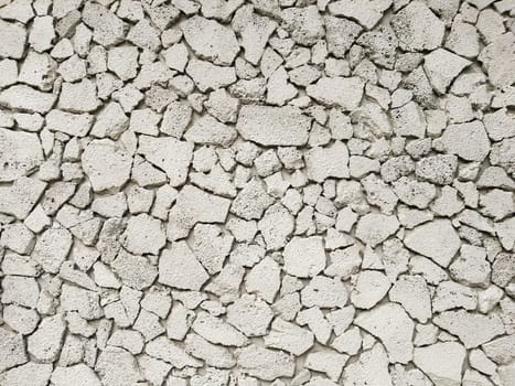 Texture of concrete in grey tone with cracked surface and dirt in cracks.old gray concrete wall for background. Concrete texture in white tone with very rough surface and large, deep cracks.