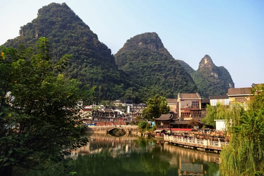 View of the cityscape by the lake among the mountains, Guilin, China on August 24, 2019 on a bright sunny day