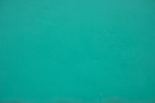Texture of blue turquoise paint wall background. Material in architecture and interior design.