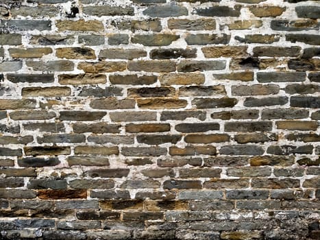 Dirty old random dark color brick wall texture background .Artificial Brick Wall Random Color . Traditional wall background .Ancient architecture .loft shabby chic vintage decoration style