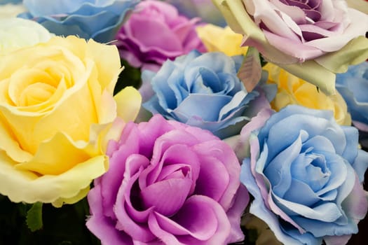 Closeup of artificial colorful roses flower bouquet.