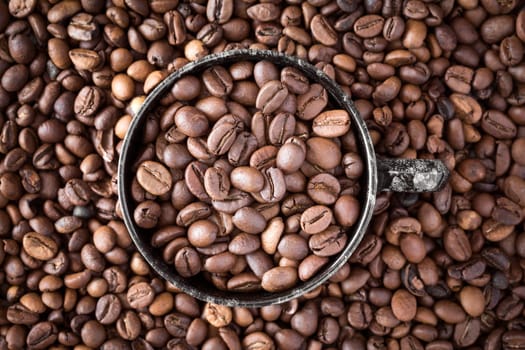 Cup of coffee on coffee beans background