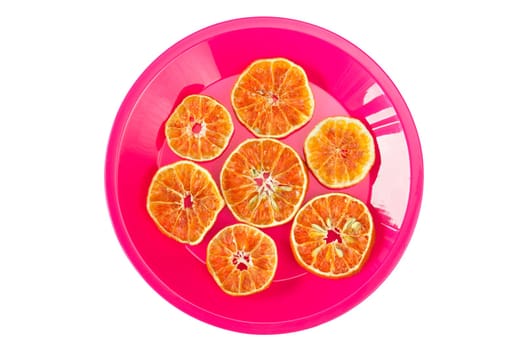 Plate with dried orange slices, isolated on white background