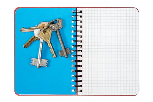 Blank notebook and bunch of keys, isolated on white background