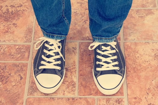 Closeup portrait of a human legs in sneakers