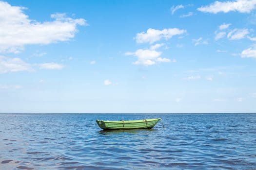Empty fishing boat floating out to sea