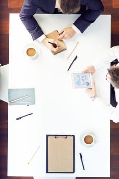 Two men working at office table