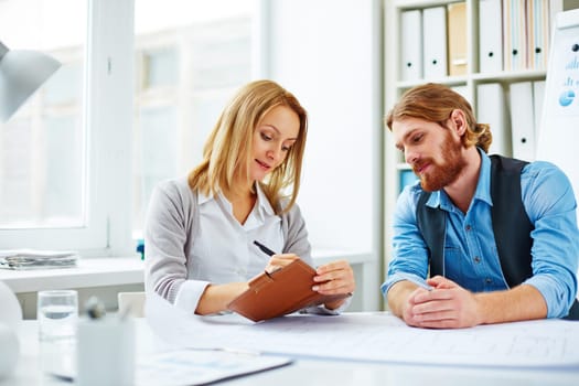Woman assigning tasks for man