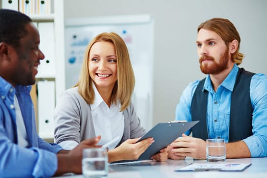 Three business people talking
