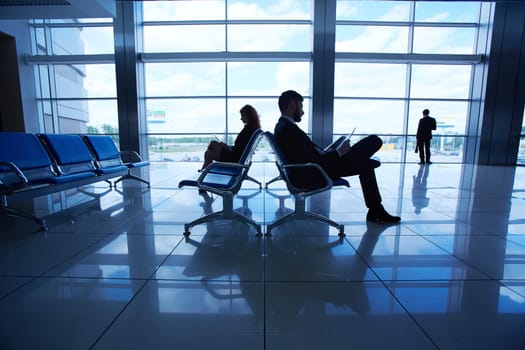 Business travelers waiting for their departure in airport
