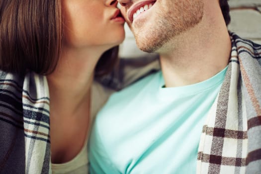 Woman kissing her man