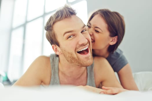 Woman flirting with her man in bed