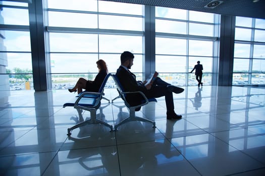 Group of businesspeople waiting for their departure in airport
