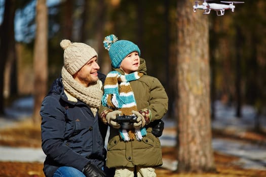 Father and son observing toy plane