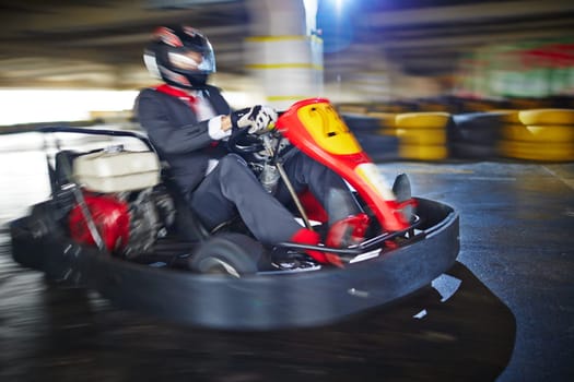 Businessman enjoying kart racing