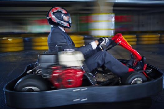 Man karting in formalwear